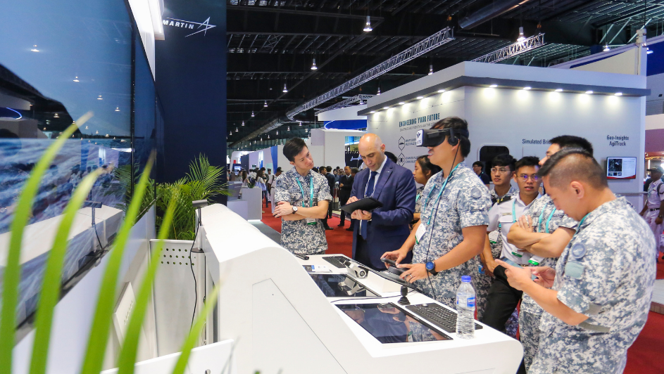 Visitors from the naval defence sector viewing exhibits at IMDEX Asia.